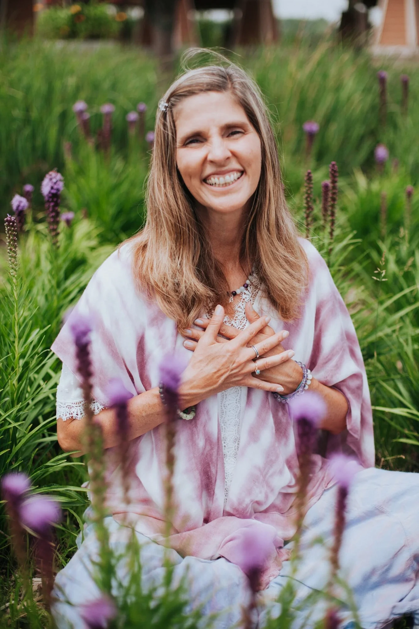 Mary Manzur smiling in a field of lavender